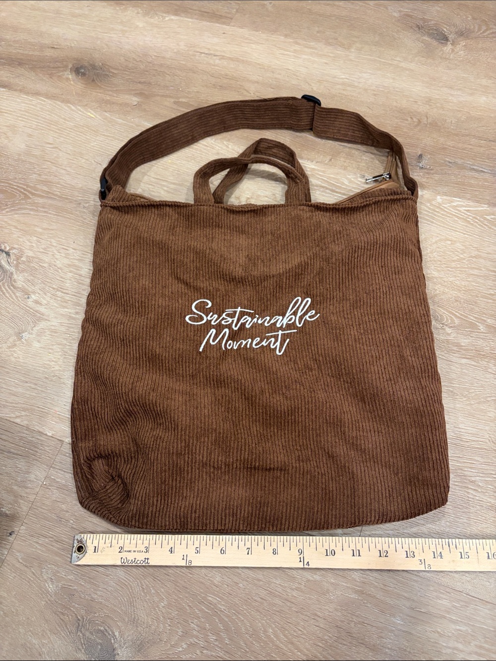 Urban Outfitters brown corduroy messenger tote with white logo